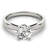White gold pinched in solitaire with round moissanite