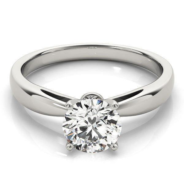 White gold pinched in solitaire with round moissanite
