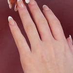 white gold round brilliant cut solitaire engagement ring with single claw diamond wedding ring