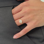 oval engagement ring with a graduated diamond halo