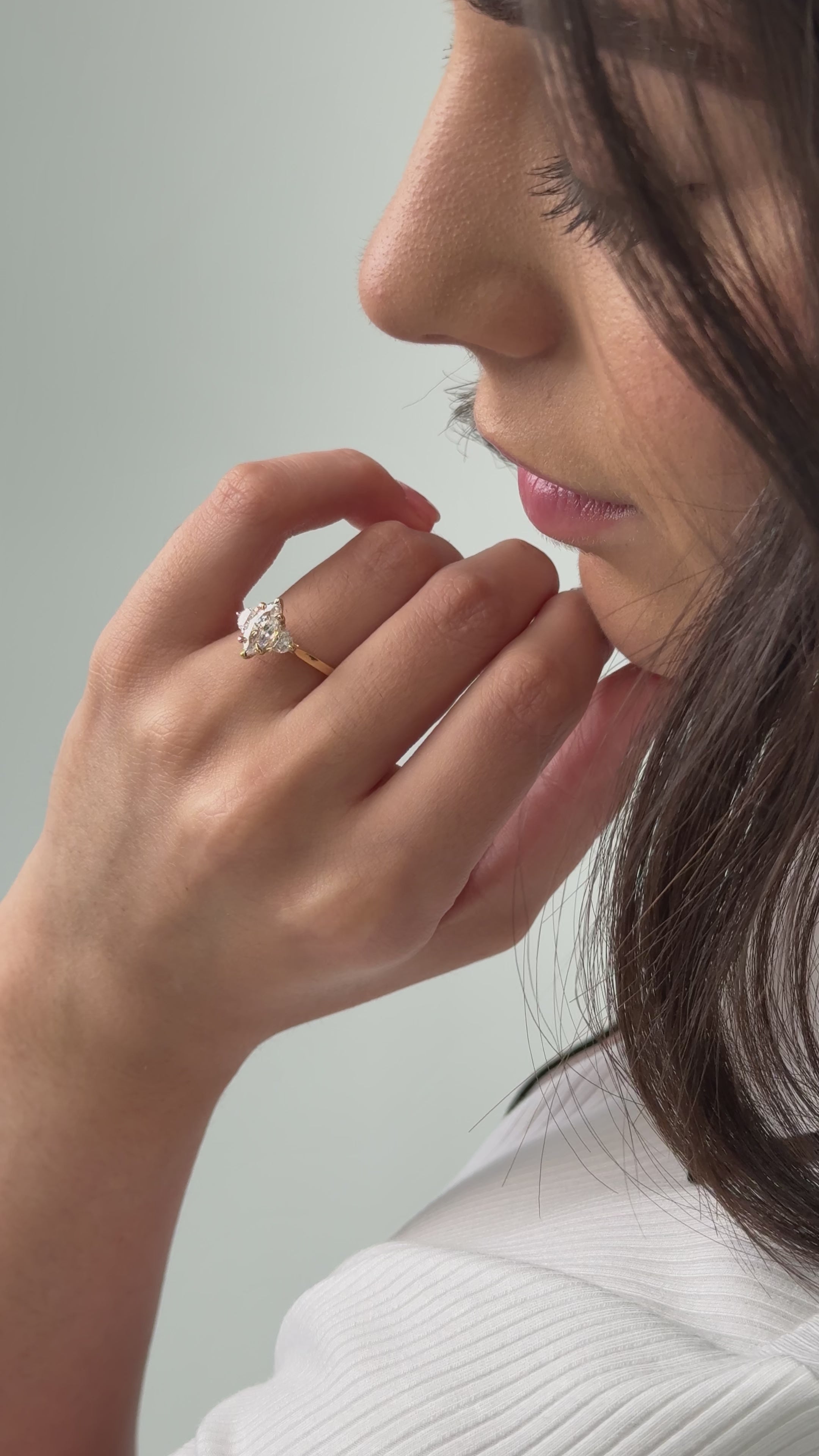 Trilogy engagement ring with marquise cut diamond centre