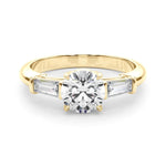 three stone trilogy engagement ring with round moissanite and tapered baguette side moissanites