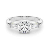 three stone trilogy engagement ring with round moissanite and tapered baguette side moissanites