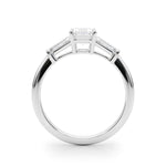 three stone engagement ring with moissanite emerald cut moissanite centre stone and baguette cut moissanite side stones