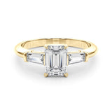 three stone engagement ring with moissanite emerald cut moissanite centre stone and baguette cut moissanite side stones