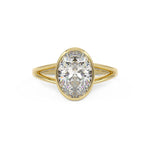 Bezel Set oval engagement with a split shank in yellow gold