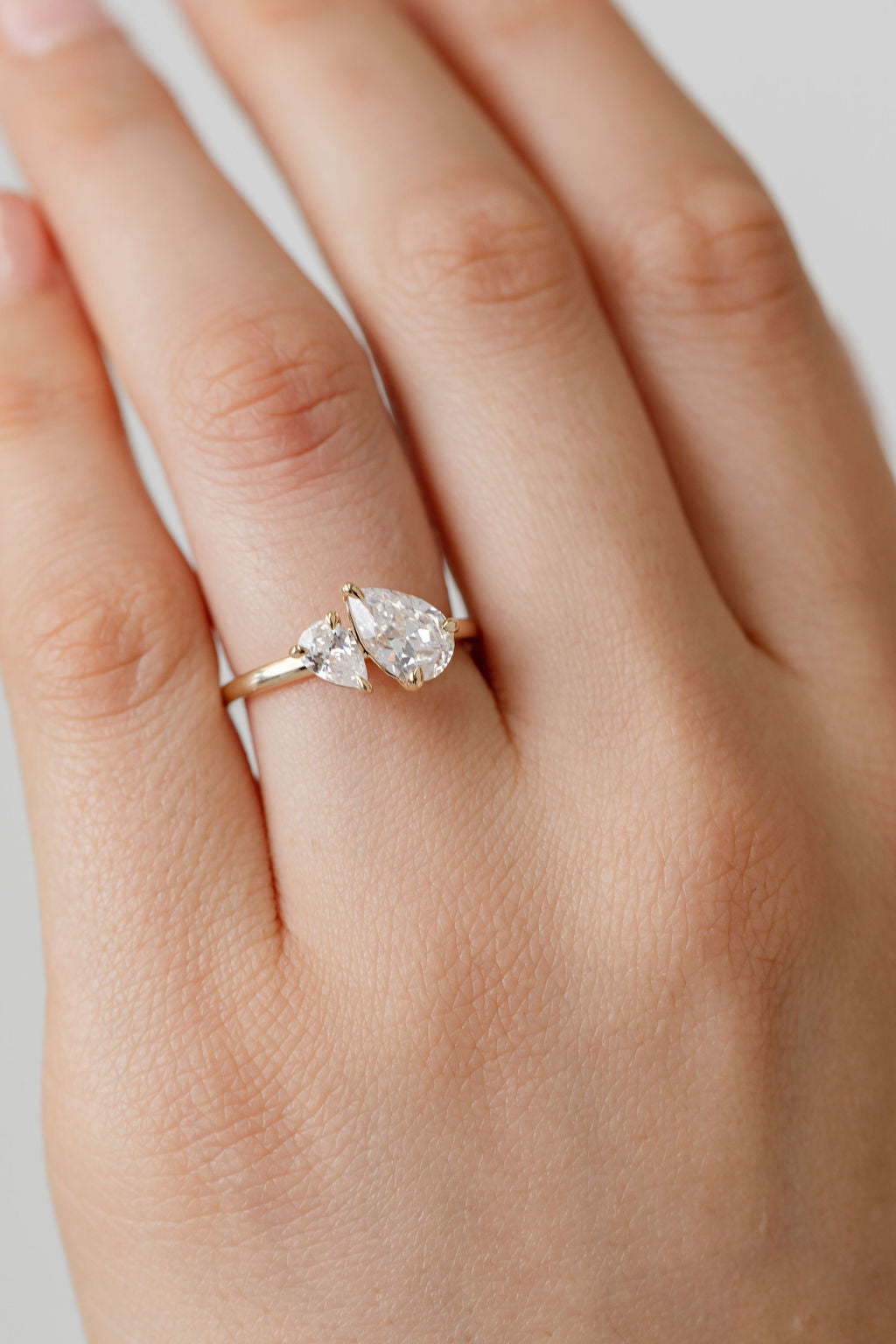 toi et moi pear cut diamond engagement ring