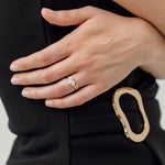 toi et moi pear cut diamond engagement ring with gold curved wedding ring