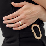 toi et moi pear cut diamond engagement ring with gold curved wedding ring