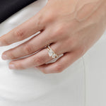 toi et moi pear cut diamond ring with diamond wedding ring