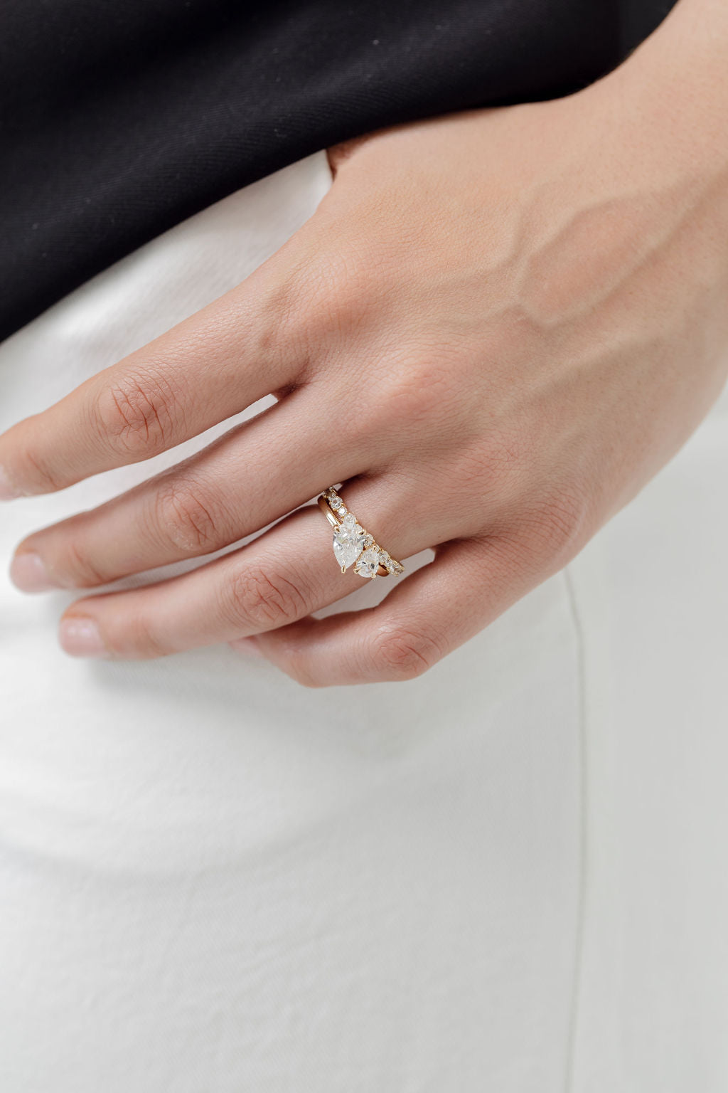 toi et moi pear cut diamond ring with diamond wedding ring