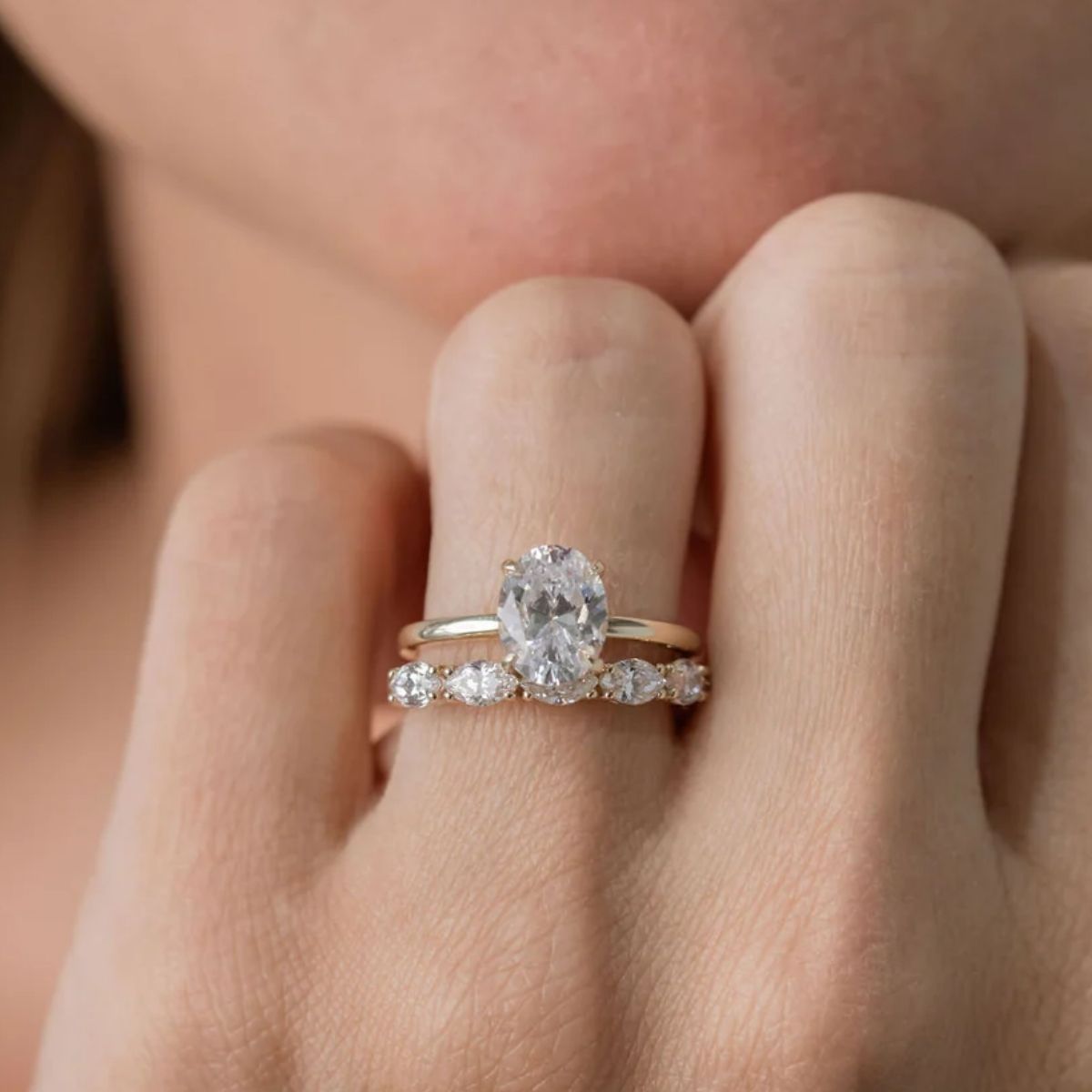Oval diamond engagement ring in modern setting showcasing elongated brilliance Adelaide