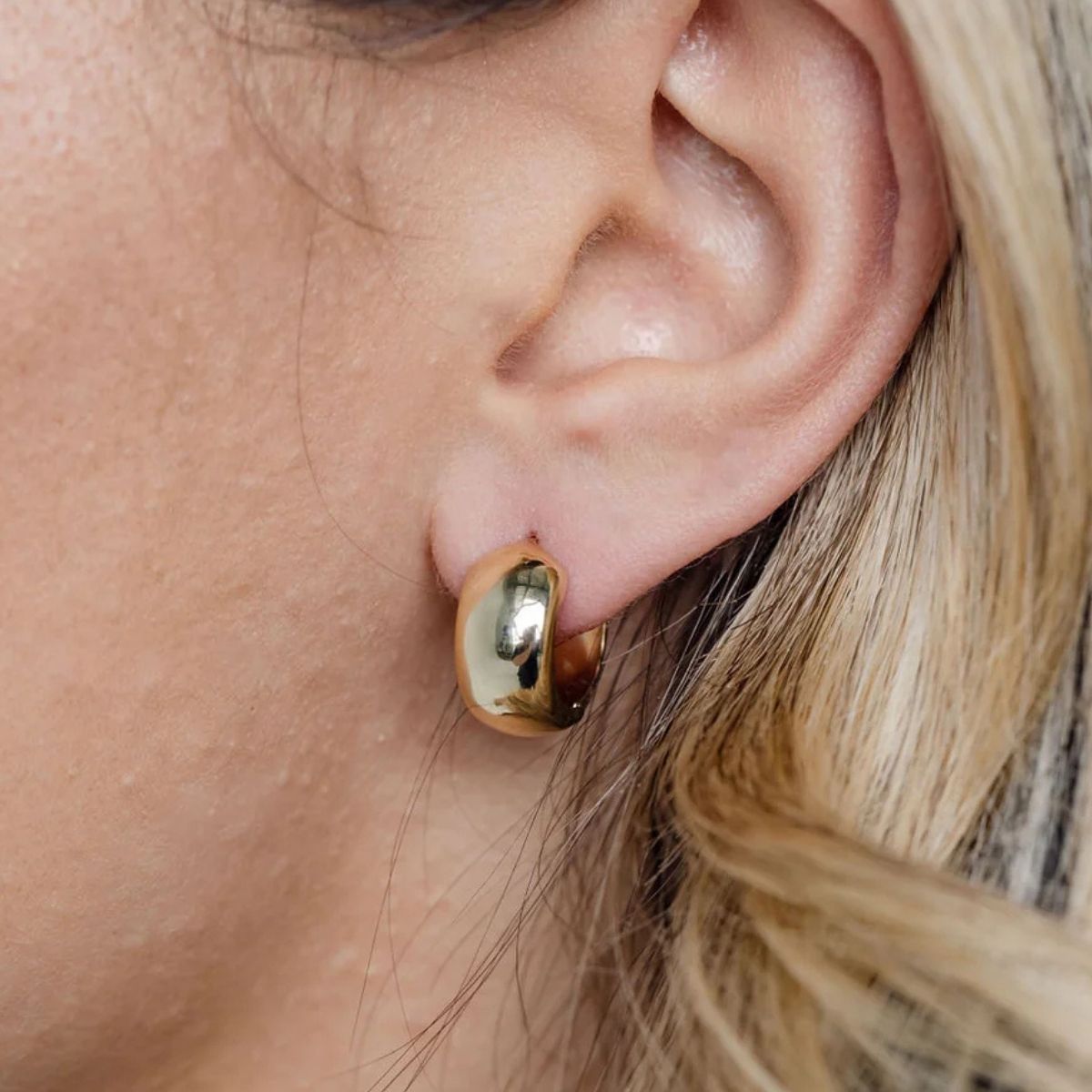 Chunky gold hoop earrings making a statement for contemporary Adelaide style