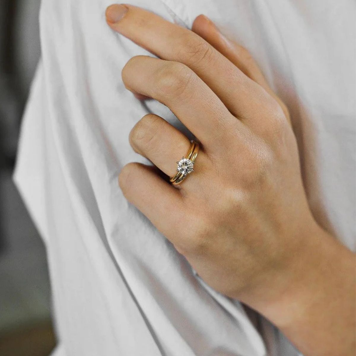 Round diamond solitaire engagement ring on hand showcasing classic timeless design Adelaide
