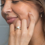 Classic round brilliant diamond solitaire engagement ring and classic diamond wedding ring in yellow gold