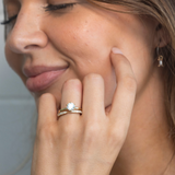 Classic round brilliant diamond solitaire engagement ring and classic diamond wedding ring in yellow gold