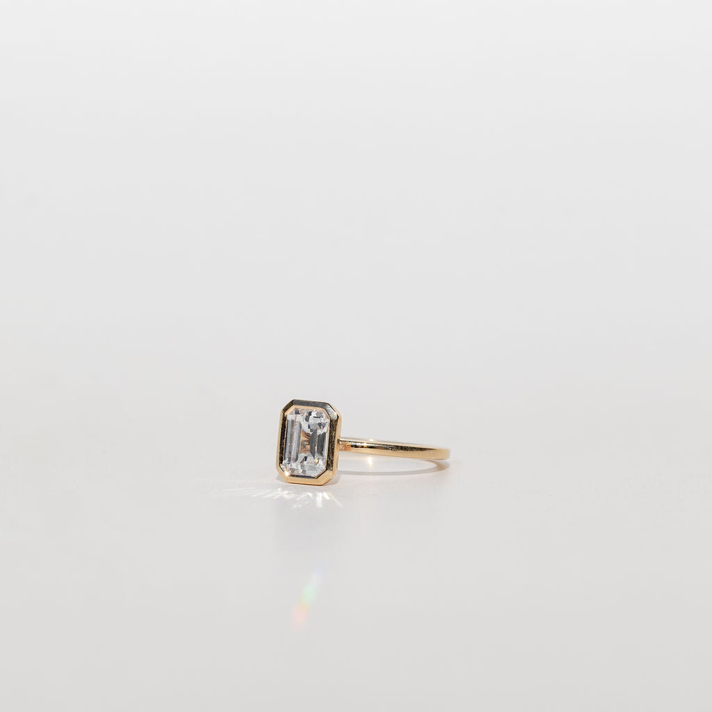 Bezel Set Emerald Cut Diamond Engagement Ring in Yellow Gold