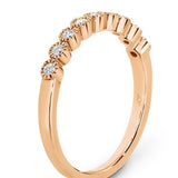 Bezel set diamonds with delicate millgrain edging eternity ring in rose gold 