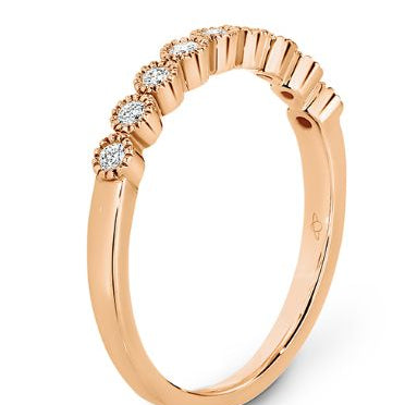 Bezel set diamonds with delicate millgrain edging eternity ring in rose gold 