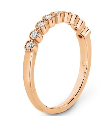 Bezel set diamonds with delicate millgrain edging eternity ring in rose gold 