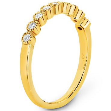 Bezel set diamonds with delicate millgrain edging eternity ring in yellow gold 