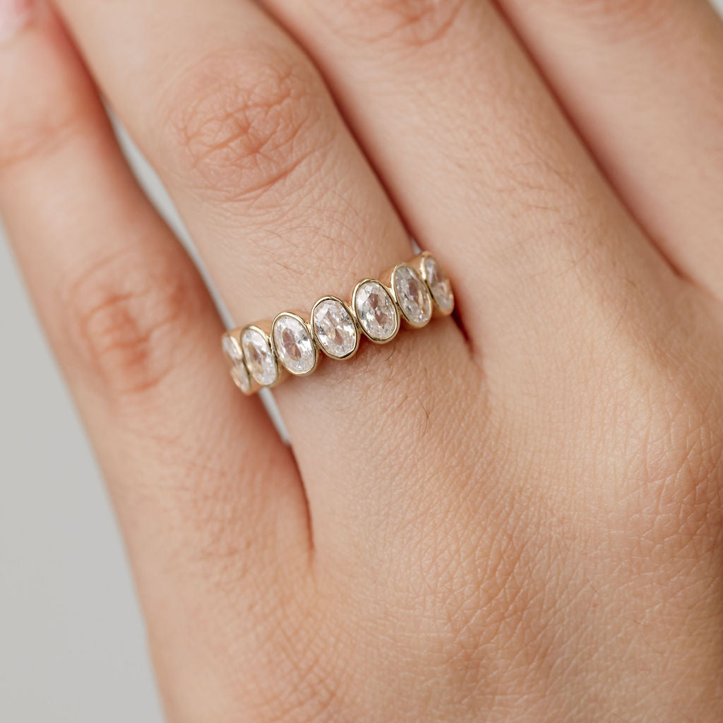 Celine Oval Bezel set wedding ring in yellow gold 2