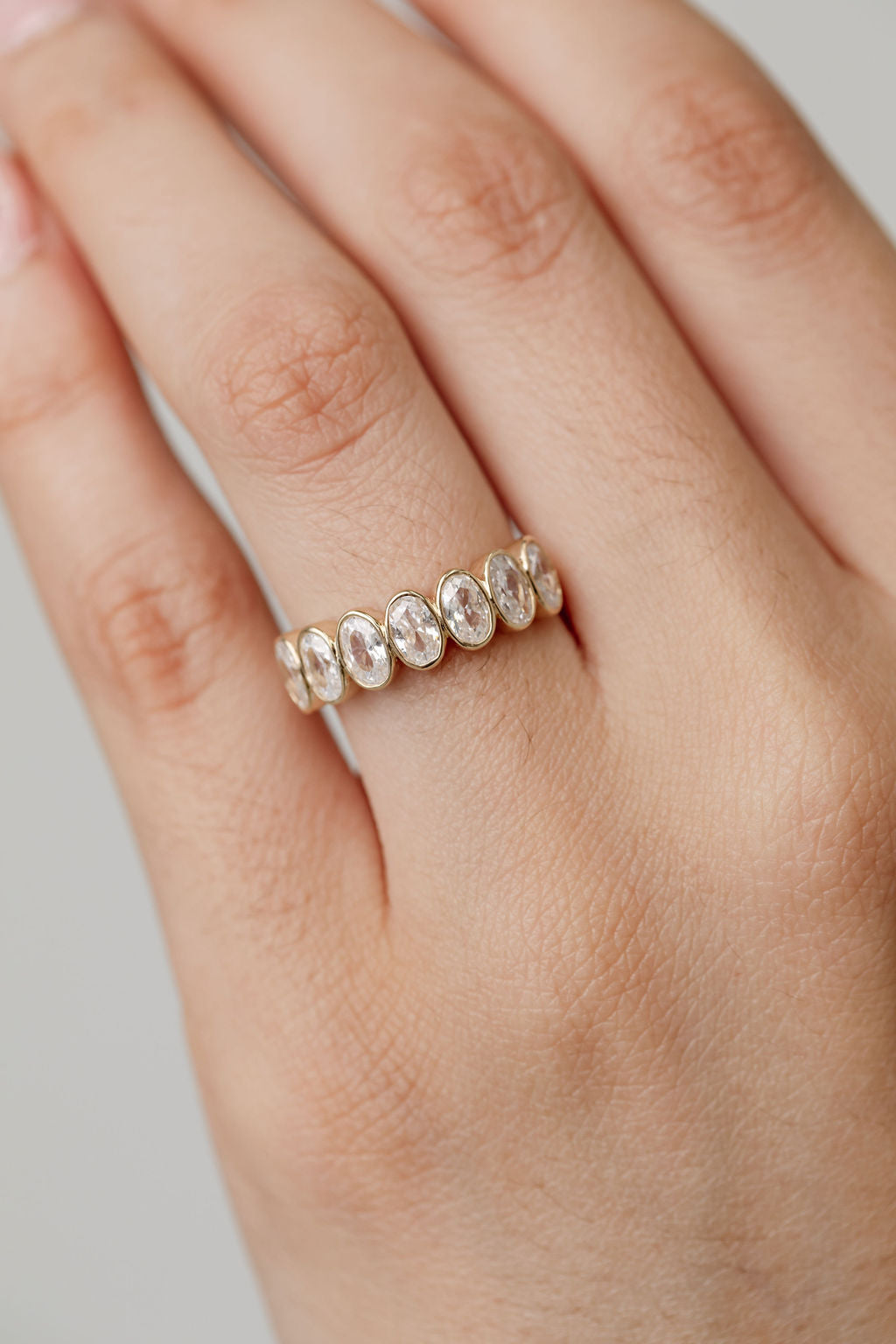 Celine Oval Bezel set wedding ring in yellow gold 2