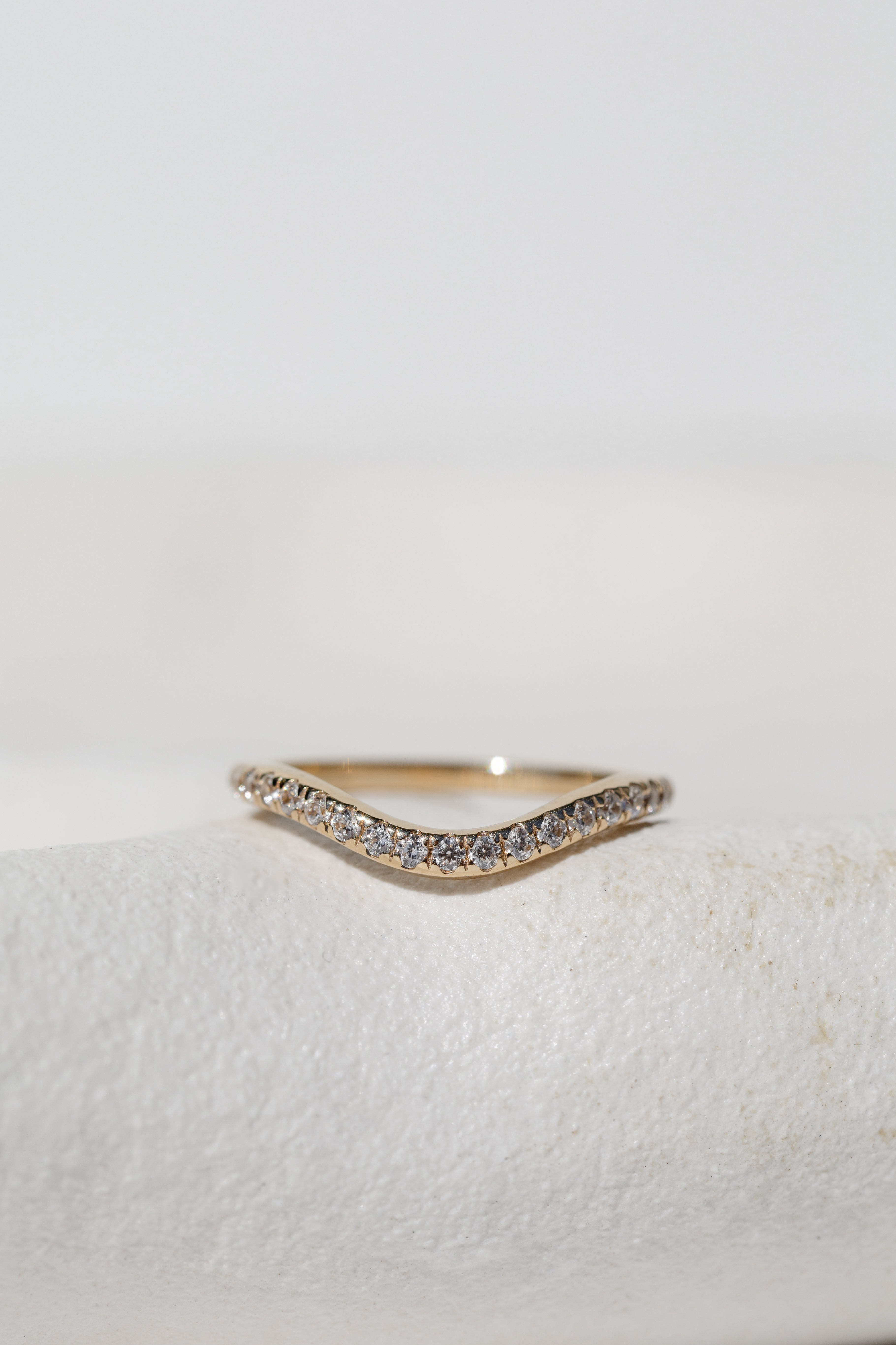 Curved diamond eternal wedding band 