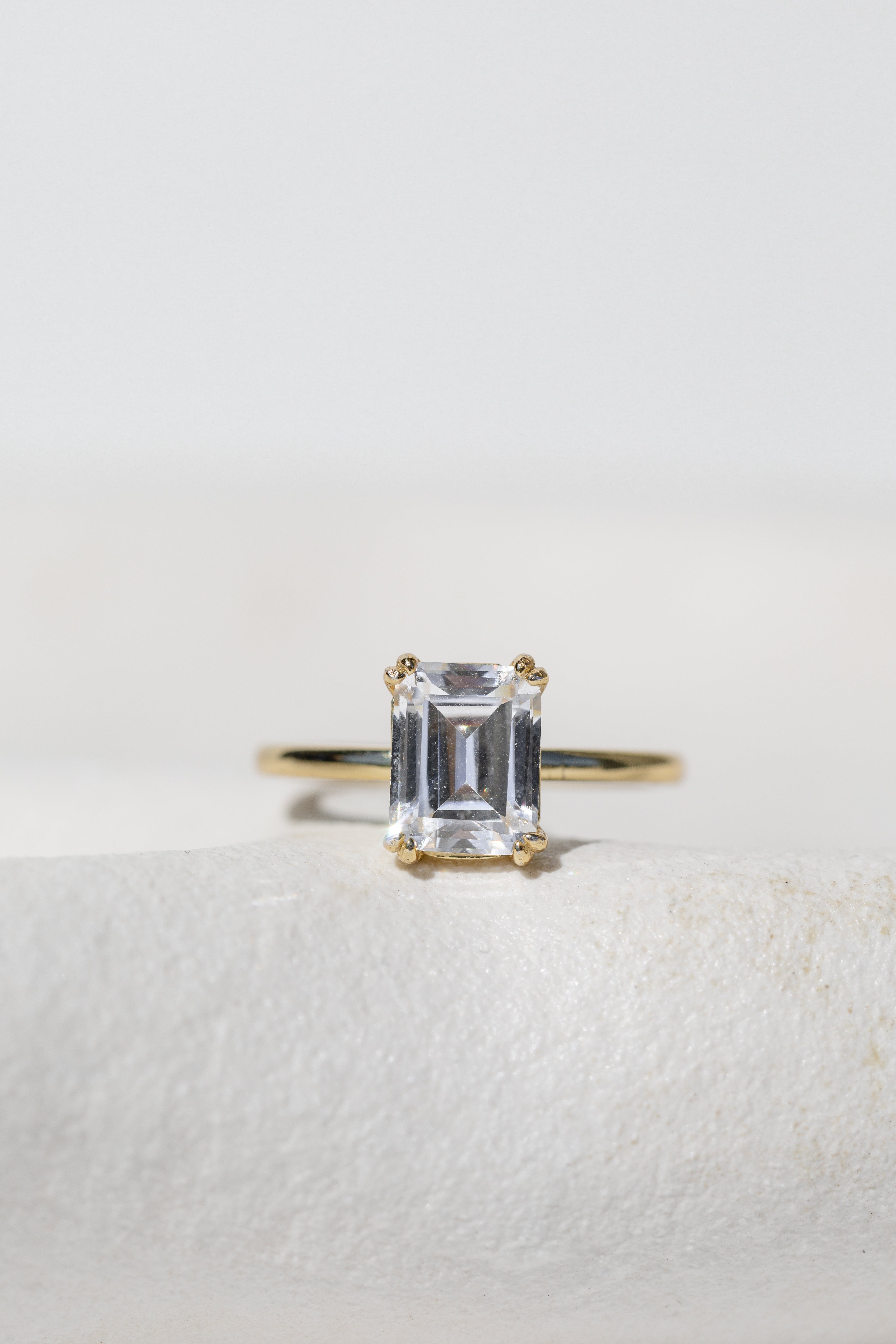DOUBLE CLAW EMERALD CUT SOLITAIRE ENGAGEMENT RING