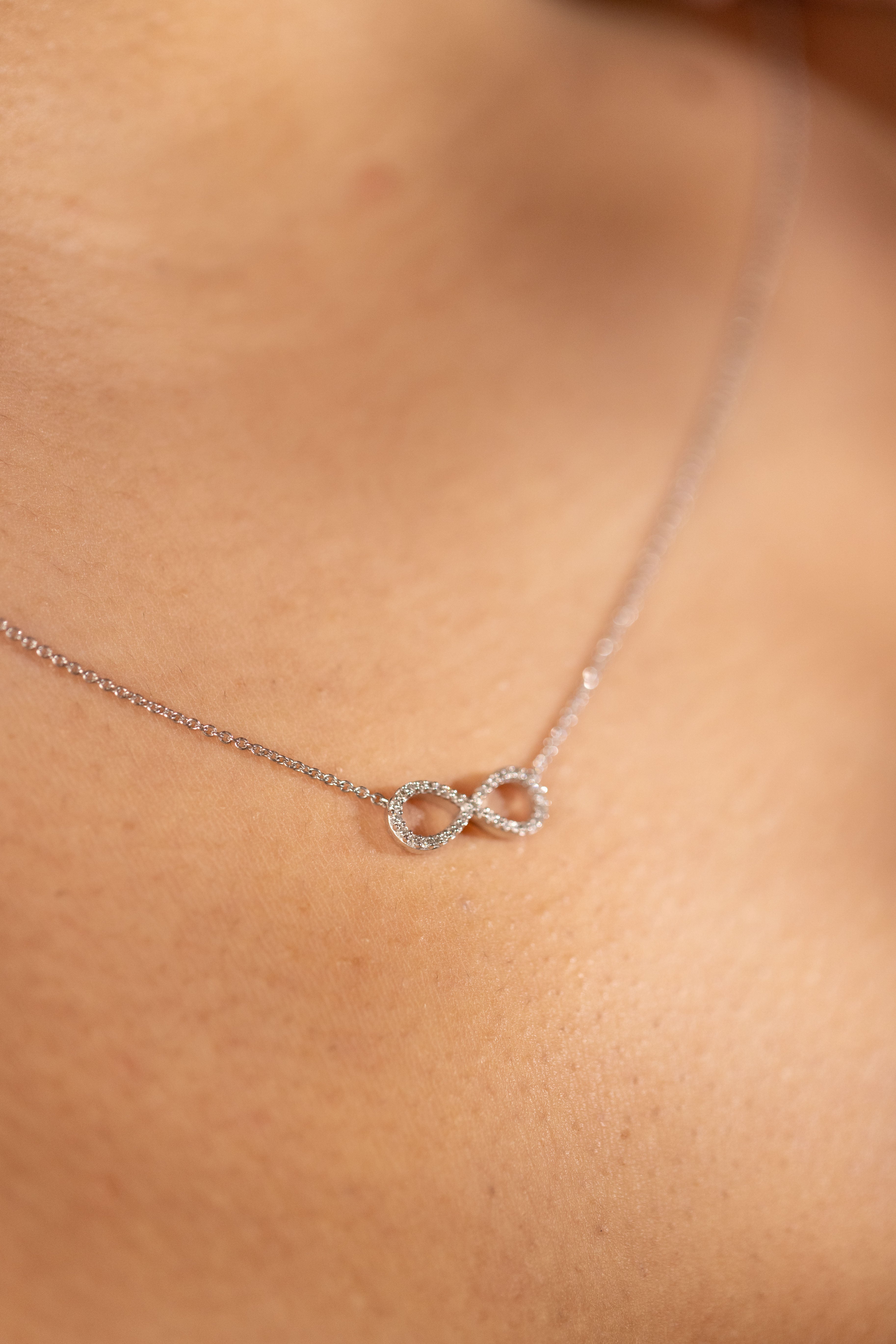 Diamond infinity necklace white gold