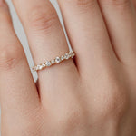 Diamond wedding ring with two sizes of diamonds