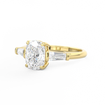 Elongated Cushion Cut 3 stone Diamond engagement ring with tapered baguette side stones yellow gold