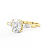 Elongated Cushion Cut 3 stone Diamond engagement ring with tapered baguette side stones yellow gold