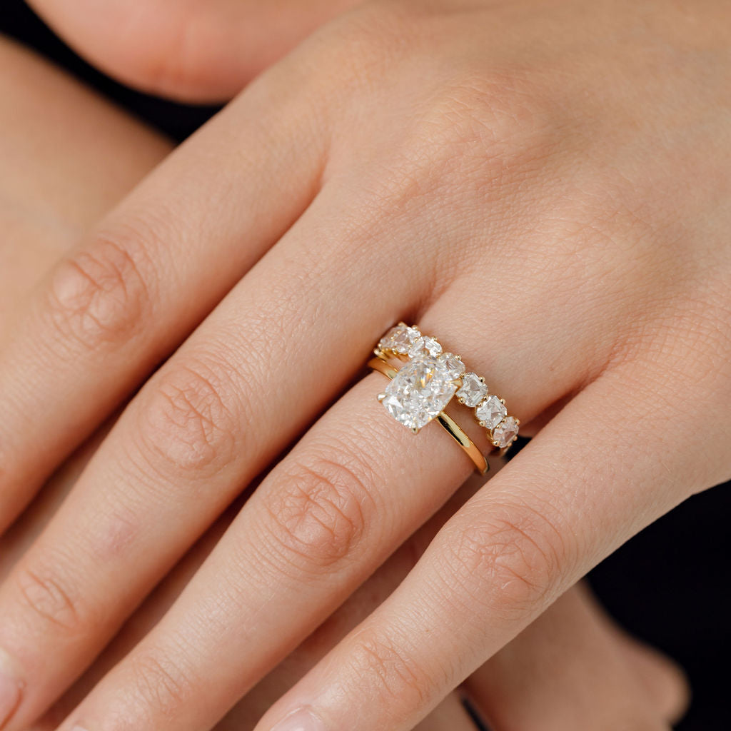 Elongated cushion cut diamond solitaire engagement ring with asscher cut diamond wedding ring