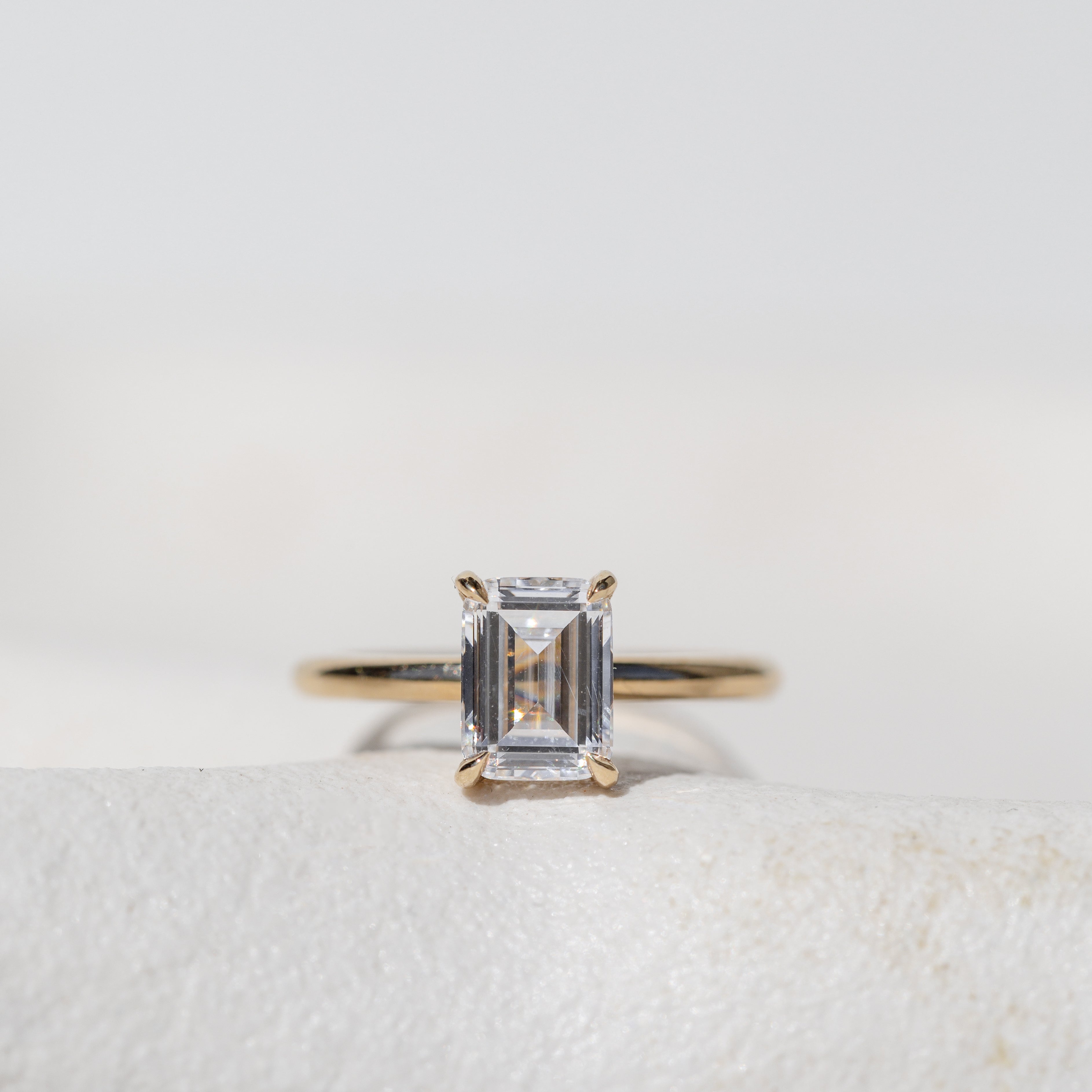 Emerald Cut Diamond Solitaire with Hidden Halo