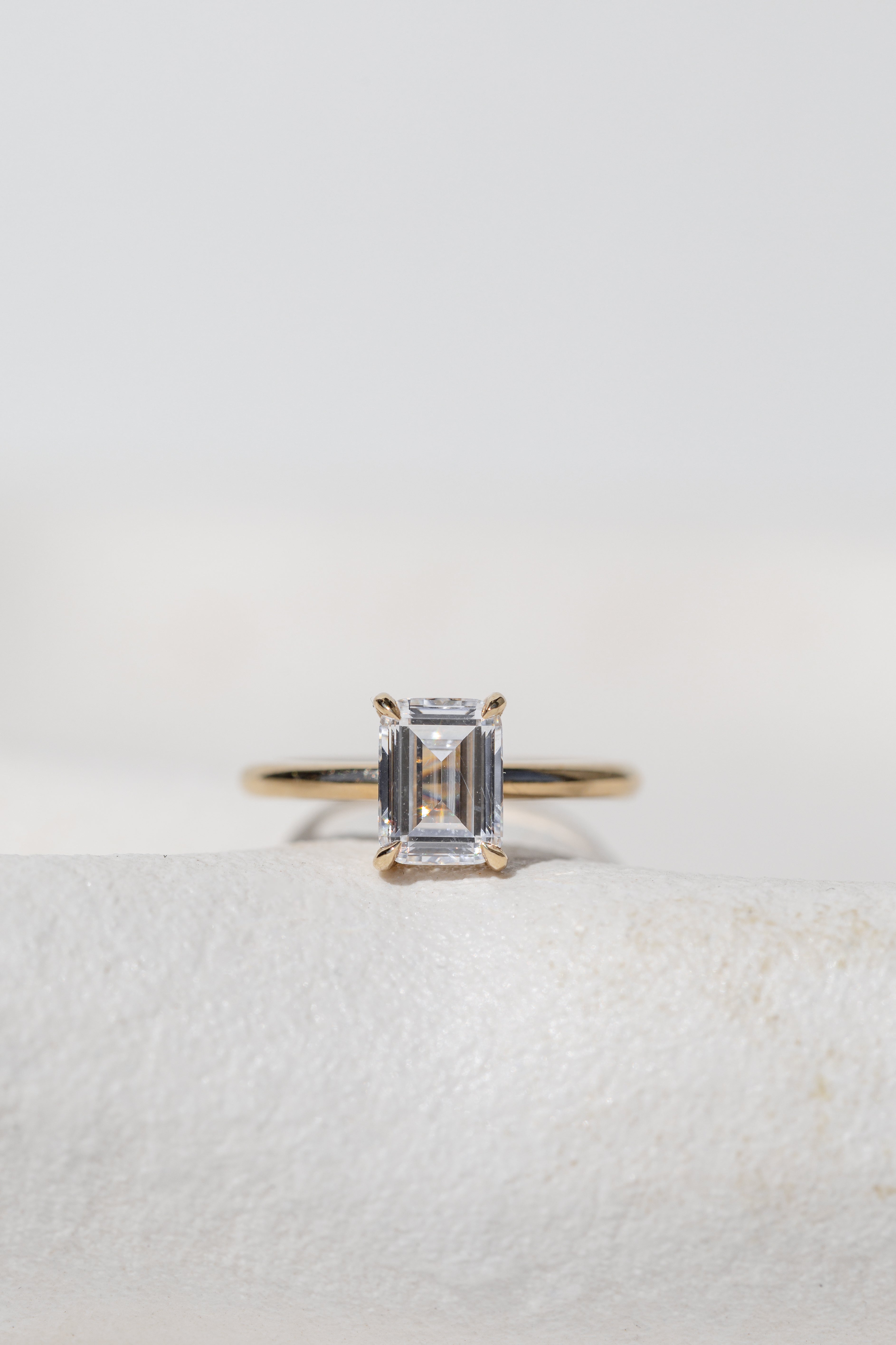 Emerald Cut Diamond Solitaire with Hidden Halo