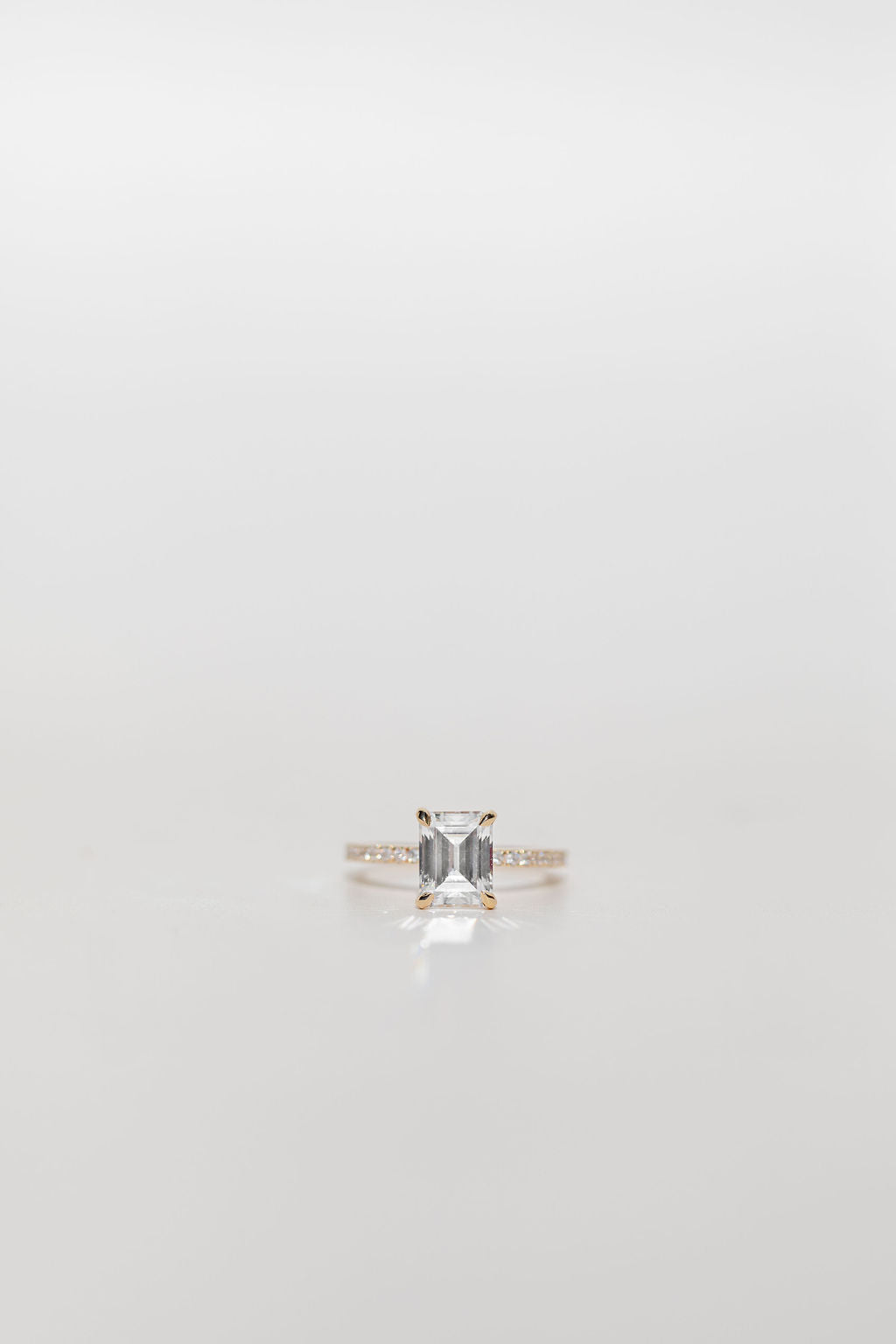Emerald Cut Diamond engagement ring with diamonds band