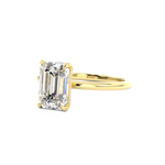 emerald cut diamond solitaire engagement ring with hidden halo
