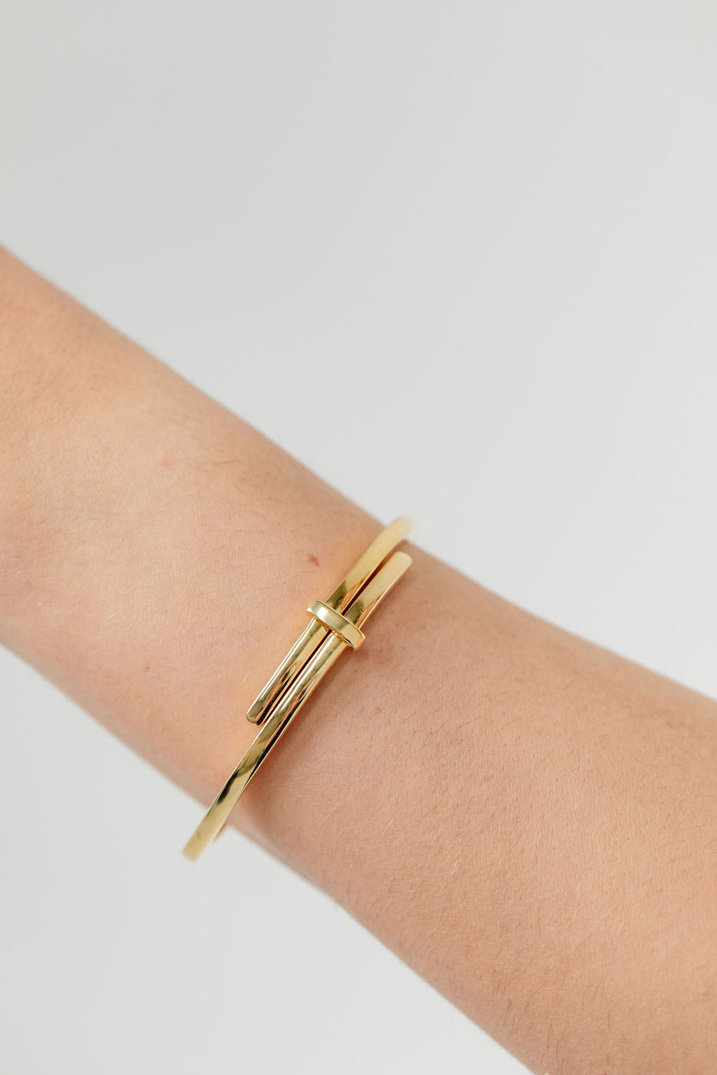 Gold crossover bangle gold plated 
