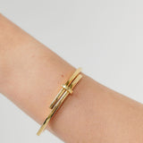 Gold crossover bangle gold plated 
