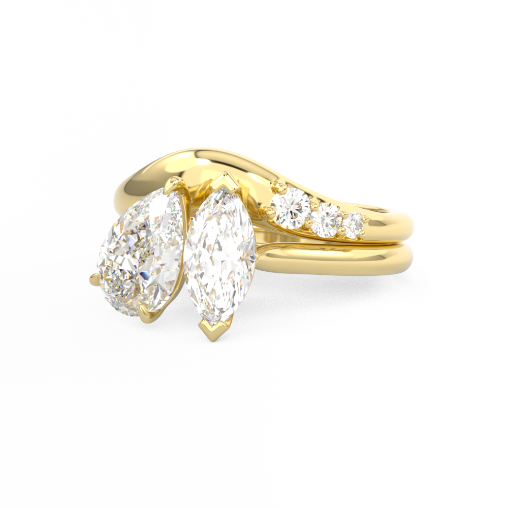 Gold curved wedding ring with diamonds around toi et moi engagement ring