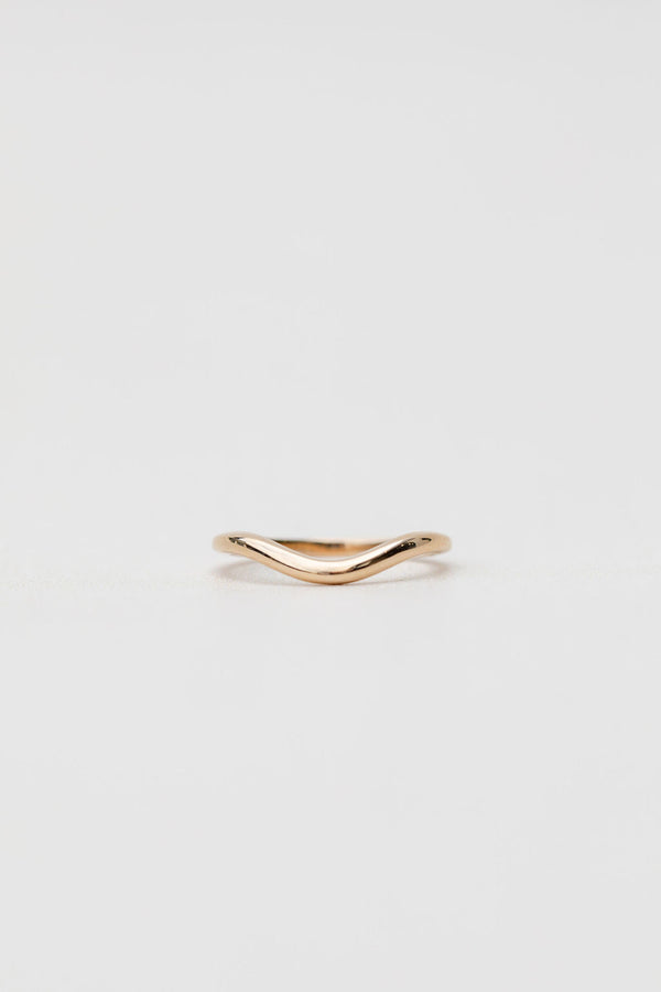Gold curved wedding ring