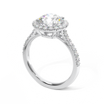 round brilliant cut diamond ring with diamond halo in platinum