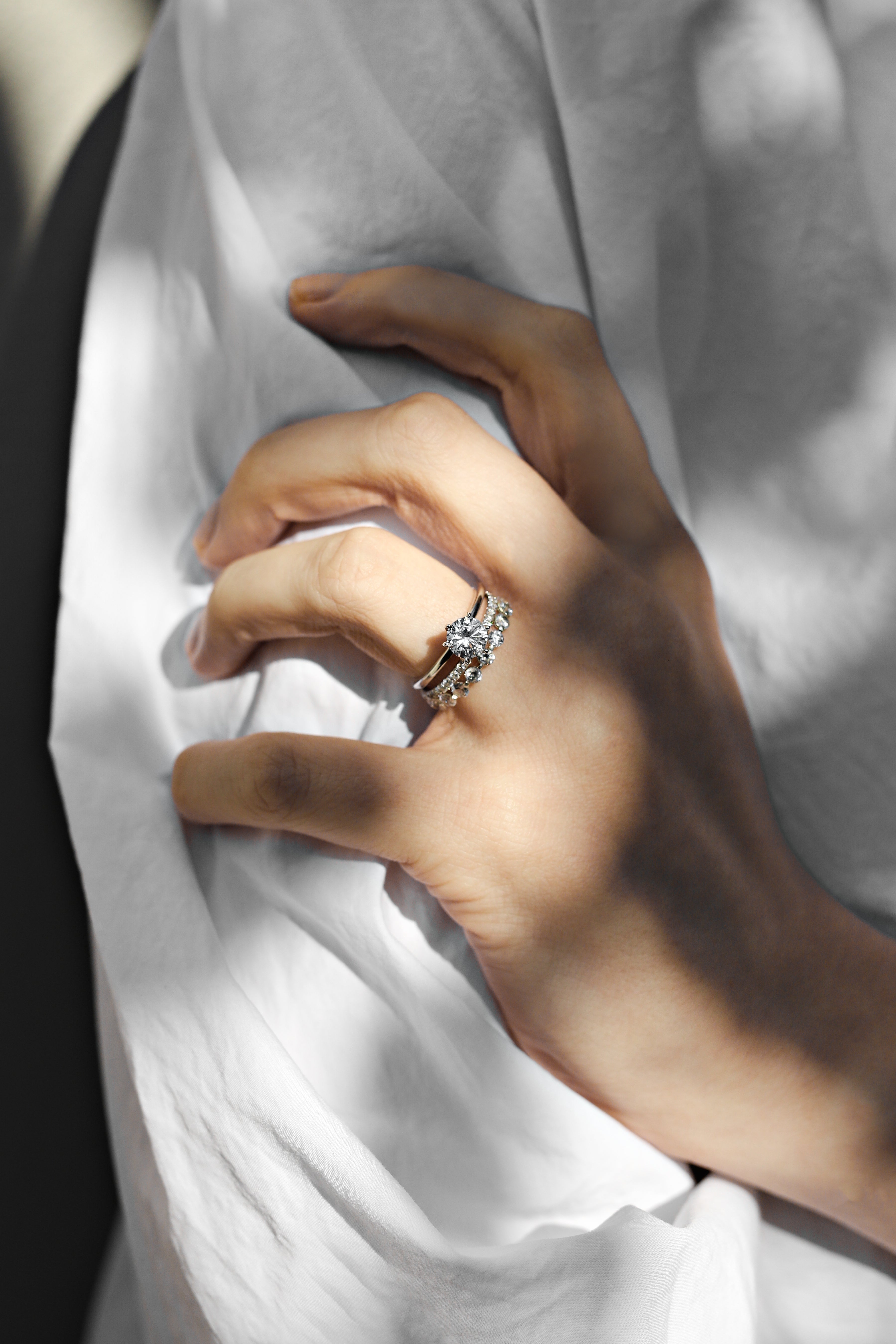 A hand showing off an engagement ring au
