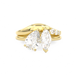 Gold curved wedding ring with diamonds around toi et moi engagement ring