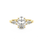 Three stone diamond engagement ring with oval cut diamond centre stone and pear cut diamond side stones