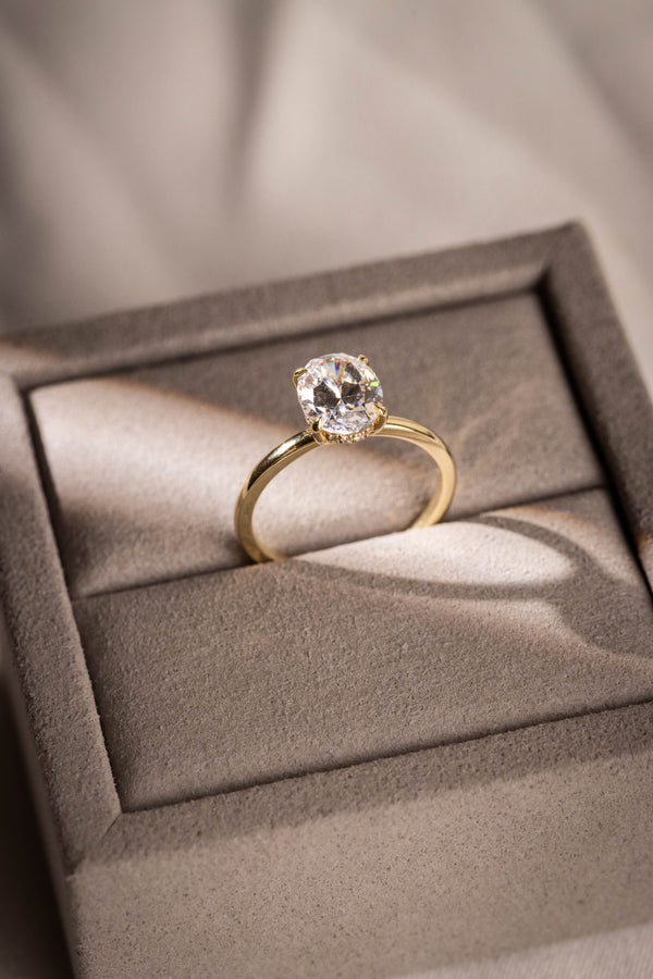 OVAL CUT DIAMOND SOLITAIRE WITH HIDDEN HALO
