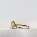 OVAL CUT DIAMOND SOLITAIRE WITH HIDDEN HALO GOLD BAND