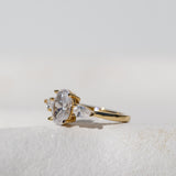 OVAL WITH PEAR SIDE STONES THREE STONE TRILOGY RING