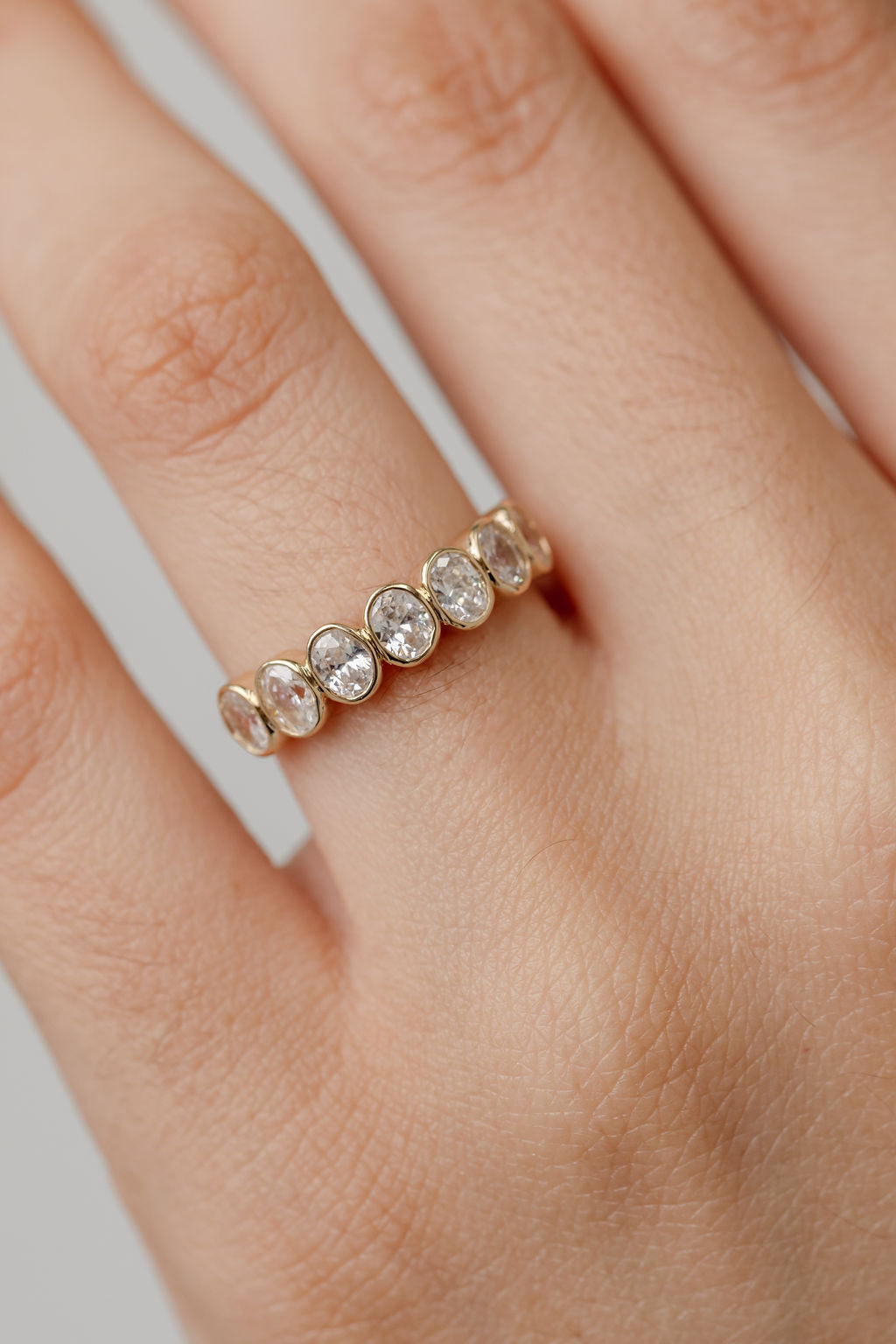 Oval Cut Diamond Bezel Set Wedding Ring  yellow gold